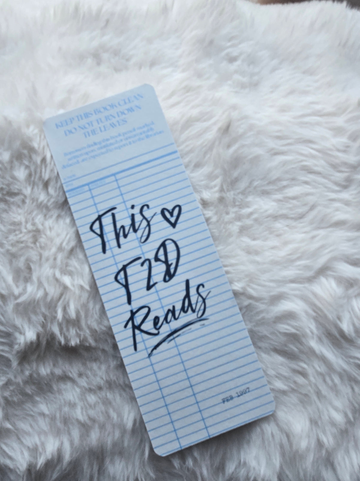 This T2D Reads Blue Library Card Bookmark